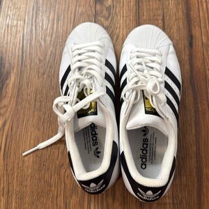 Adidas superstar shoes.